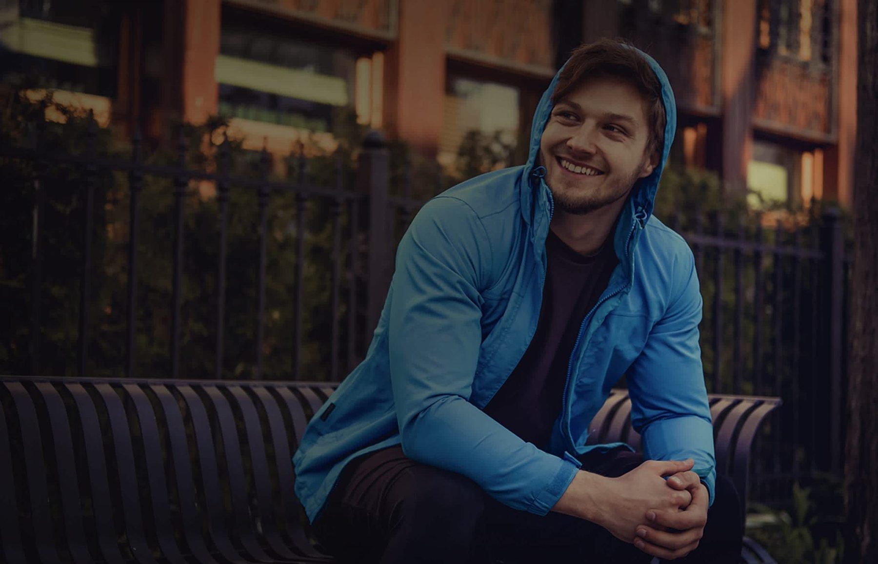 A young person sitting outside, from the JBVC Foundation website