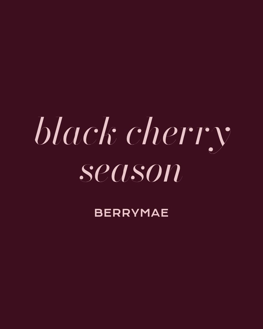 A BerryMae social post reading black cherry season, in blush lettering on black cherry